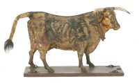 Lot 118 - A pull-along papier mâché cow