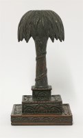 Lot 119 - An unusual carved and stained wood candlestick