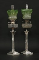 Lot 340 - A pair of Victorian silver-plated Corinthian column oil lamps