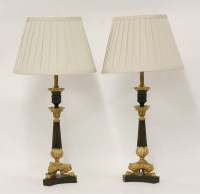 Lot 363 - A pair of Regency bronze and parcel gilt candlesticks