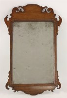 Lot 520 - A George III mahogany fret cut mirror