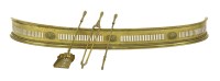 Lot 352 - A neoclassical curved brass fender
