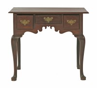 Lot 432 - A walnut lowboy