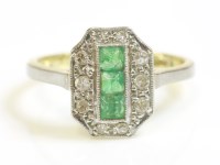 Lot 406 - An Art Deco emerald and diamond rectangular cluster ring with cut corners