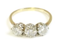Lot 502 - A three stone diamond ring with three old brilliant cut diamonds