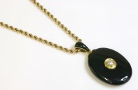 Lot 303 - A late Victorian oval gold hinged memorial locket