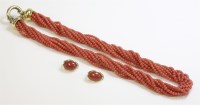 Lot 446 - A ten row coral bead torsade necklace