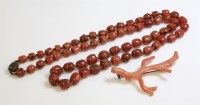 Lot 460 - A single row graduated coral bead necklace