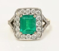 Lot 573 - An 18ct gold emerald and diamond rectangular cluster ring