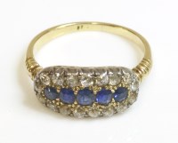 Lot 352 - An Edwardian sapphire and diamond oval cluster ring