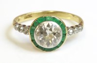 Lot 405 - An Art Deco diamond and emerald target ring