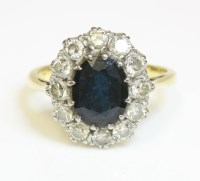 Lot 494 - A sapphire and diamond oval cluster ring