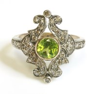 Lot 483 - A Continental peridot and diamond lozenge cluster ring