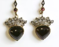 Lot 486 - A pair of Continental garnet and diamond drop earrings