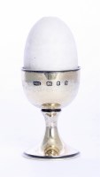 Lot 213 - A silver gilt and enamel egg