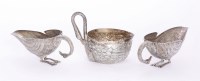 Lot 29 - A pair of Mexican metalwares sauce boats