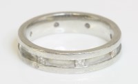 Lot 559 - A platinum diamond set wedding ring or band ring