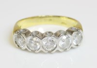 Lot 503 - A gold five stone diamond half eternity ring