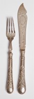 Lot 108 - A rare set of twenty-four pairs of Victorian silver venetian pattern fish eaters