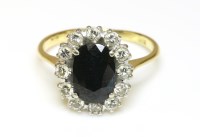 Lot 496 - An oval sapphire and diamond cluster ring