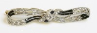 Lot 395 - A Continental Art Deco diamond and hardstone bow brooch