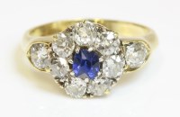 Lot 351 - An Edwardian sapphire and diamond cluster ring with diamond set shoulders