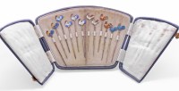 Lot 215 - A set of twelve novelty silver cocktail sticks
