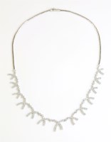 Lot 582 - An 18ct white gold diamond set graduated fringe necklace