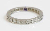 Lot 411 - A diamond set full eternity ring