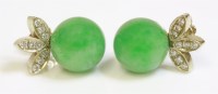 Lot 457 - A pair of jade and diamond stud earrings