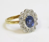 Lot 507 - An 18ct gold sapphire and diamond oval cluster ring by Fred E Ullman