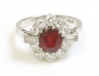 Lot 586 - A ruby and diamond cluster ring