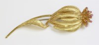 Lot 83 - An Italian gold and ruby set flower brooch