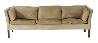 Lot 703 - A light tan three-seater settee