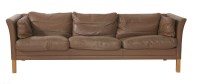 Lot 710 - A chocolate leather three-seater settee