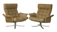 Lot 776 - A pair of sandy leather lounge chairs
