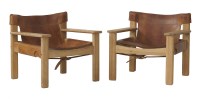 Lot 789 - A pair of pine lounge armchairs