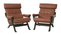 Lot 808 - A pair of stained bentwood and tan leather lounge armchairs (2)