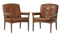 Lot 810 - A pair of tan leather armchairs
