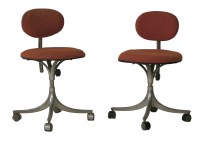 Lot 823 - A pair of aluminium and orange upholstered revolving desk chairs