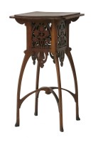 Lot 474 - An Art Nouveau oak lamp table