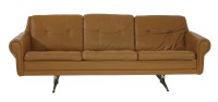 Lot 700 - A tan leather three-seater settee