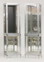 Lot 727 - A pair of chrome and glazed two-tier cabinets