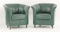 Lot 529 - A pair of green leather armchairs