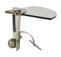 Lot 673 - A polished steel occasional table
