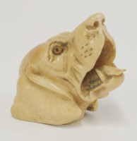 Lot 43 - A carved ivory walking stick grip