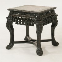 Lot 395 - A carved blackwood Vase Stand