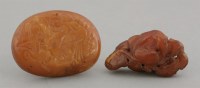 Lot 244 - An oval amber Plaque
