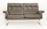 Lot 593 - A Danish brown leather two-seater lounge settee