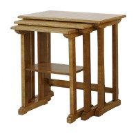 Lot 148 - A walnut nest of three tables